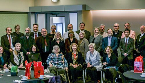 Faculty Honorees posing for a picture in the Campus Center. 