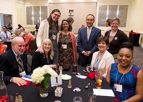 The Chancellor's Office posing with retiree Christine Fitzpatrick at Faculty Retiree Luncheon 